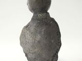 an image of a stone statue of a man with a ball on his head