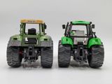 two toy tractors that are sitting next to each other