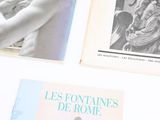 three books on a table with pictures of a woman