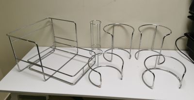 four chairs that are sitting on a white table