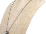 a close up of a mannequin torso with a necklace on it