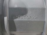a close up of a black ball valve on a white surface