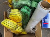 a box full of yellow and green items on the ground