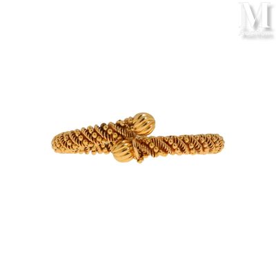 a close up of a gold ring on a white background
