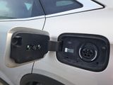 an electric car plugged in to a charging station
