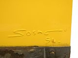 a close up of a sign on the side of a yellow train