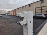 a close up of a white door handle on a building