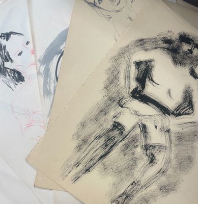 several drawings of a man sitting on a chair in front of a table