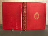 an old red book opened to show the inside of it