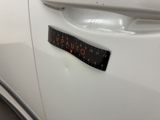 a sticker on the door handle of a car