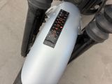a close up of a motorcycle with a speedometer on it ' s handlebars