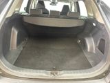 the back of a car with the trunk open and the seats down