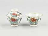 pair of chinese porcelain vases with flowers and birds on them