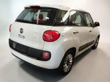 the rear end of a white fiat fiorin parked in a white room