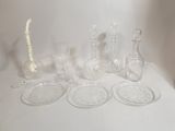 a lot of glass items sitting on a white table