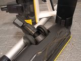 a picture of a vacuum cleaner and a cell phone on a counter