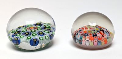 two glass balls that have different designs inside of them
