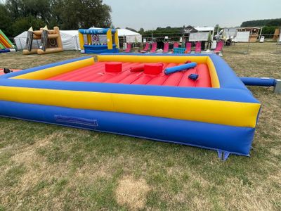 a large inflatable pool with a slider and a slider