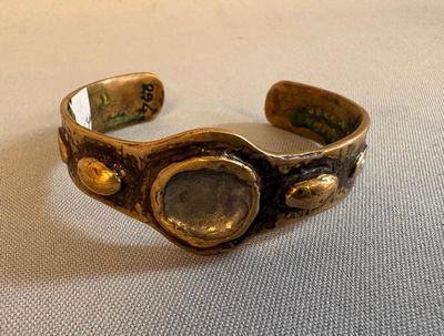 an image of a close up of a bracelet on a table