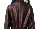 brown leather jacket with pink skirt and scarf on mannequin head