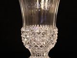 a glass vase that is sitting on a table