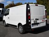 a white van that is parked in a parking lot