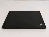 a black laptop on a white surface with a white background