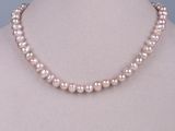 a pink pearl necklace on a mannequin mannequin mannequin mannequin mannequin mannequin mannequin mannequin manne
