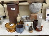 many different types of pottery on display on a table