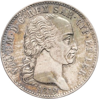 a close up of a coin with a man ' s face on it