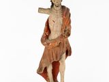 an old statue of a man holding a baseball bat on a white background