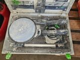 a box with tools inside of it on a wooden table