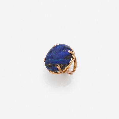 a lapis ring with a blue stone in the center
