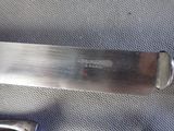 a knife that is laying on top of a piece of cloth