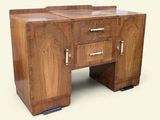 a wooden desk with two drawers and a cabinet