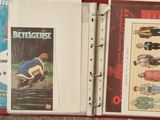 a red binder with a picture of a man riding a skateboard on it