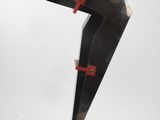 black and red sculpture on black base on white background