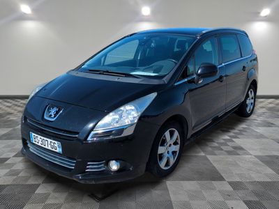 a picture of a small black car parked in a garage