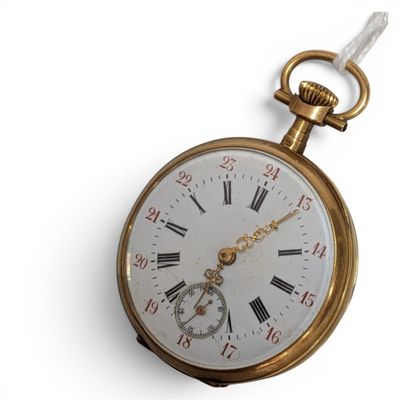 a gold pocket watch with roman numerals on it