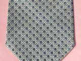 a close up of a tie on a pink background