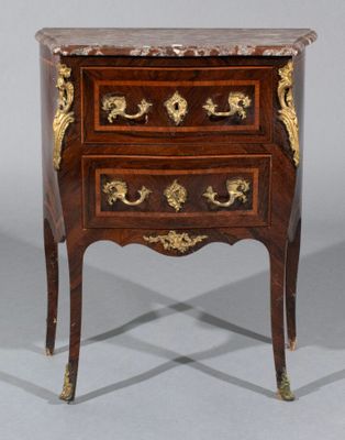 an antique chest of drawers with a marble top on a stand
