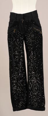 pantalon noir à paillettes avec des fermetures éclair sur les côtés