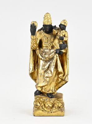 gold statue of a man holding a child on a white surface