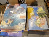 two paintings that are sitting on top of a table