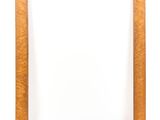 an empty wooden picture frame on a white background