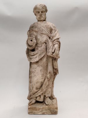 an old statue of a woman holding a child in her arms