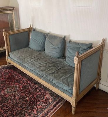 an image of a living room with a couch and a rug