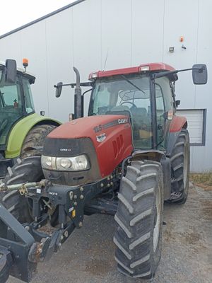 two tractors parked next to each other in a parking lot
