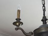 a chandelier hanging from the ceiling in a room