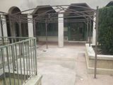 a building that has a metal structure in the middle of it